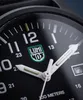 A close-up view of a Luminox watch face, showing the hands, numbers, and logo. Voir les images du produit