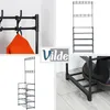 A collage of images showing a black metal coat rack with shoe shelves, including a close-up of the coat rack and a detail of a shoe on one of the shelves. An orange coat is also shown hanging on the rack. Anteprima dell’immagine prodotto