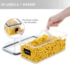 A hand is scooping pasta from a clear storage container, with a label on the container that says 'pasta'. Produktbild-Vorschau