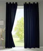 A pair of dark blue curtains are shown hanging in front of a window with a tree visible outside. Produktbild-Vorschau