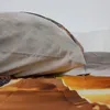 A close-up view of bedding with a printed pattern. Náhľad obrázku produktu