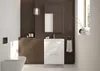A modern bathroom with a white vanity, sink, and toilet against a dark brown tiled wall. Voir les images du produit
