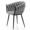 A gray velvet armchair with a braided backrest and black metal legs is shown from the side against a white background. Náhľad obrázku produktu