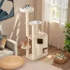 A multi-level cat tree with several cats on it, placed in a living room setting. Podgląd zdjęcia produktu