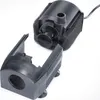 A black water pump and its detached filter cover are shown against a white background. Produktbild-Vorschau