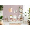 A dining room setting with a table, chairs, and shelves, decorated with plants. Produktbild-Vorschau