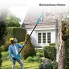 A man is using a telescopic pole saw in a garden next to a house. Produktbild-Vorschau