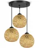 A triple pendant light with woven bamboo shades hangs from a black ceiling plate. Podgląd zdjęcia produktu