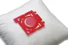 A close-up shot of a white vacuum cleaner bag with a red plastic adapter. Náhľad obrázku produktu