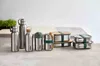 A collection of stainless steel food and drink containers arranged on a neutral surface. Náhled obrázku produktu