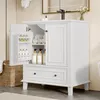 A white bathroom vanity cabinet with its doors open, showing storage space and items inside. Anteprima dell’immagine prodotto