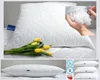 A collage of images showing a white pillow, a close-up of pillow filling, and a stack of pillows with icons. Produktbild-Vorschau