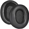 Two black headphone ear pads are shown on a white background. Voir les images du produit