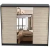 A wardrobe with mirrored doors reflecting a bedroom interior. Produktbild-Vorschau