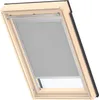 A VELUX Original Verdunkelungsrollo Classic for VELUX roof window S08, in gray, is shown installed in a wooden framed roof window. Produktbild-Vorschau