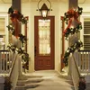 A decorated porch with snow and Christmas lights. Produktbild-Vorschau