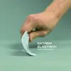 A hand is shown bending a light blue silicone spatula to demonstrate its extreme elasticity. Anteprima dell’immagine prodotto