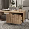 A living room scene with a coffee table, sofa, and artwork. Produktbild-Vorschau