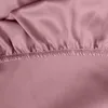 A close-up view of a pink fitted sheet with elastic gathering. Náhľad obrázku produktu