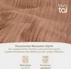 Close-up of textured fabric with text and icons below. Voir les images du produit