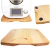 A collage of images showing a wooden board designed to fit under a kitchen appliance, specifically a Thermomix. Produktbild-Vorschau