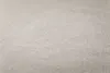 A close-up, textured view of a light gray fabric. Produktbild-Vorschau