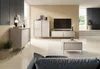 A modern living room with a beige sideboard, a TV stand, a coffee table, and a sofa. Produktbild-Vorschau
