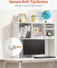 A white desk organizer shelf unit with books, a globe, and a framed picture on top, with a computer monitor and keyboard on the desk below. A close-up inset shows an anti-tip device. Náhled obrázku produktu