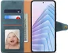 A blue flip case for a smartphone, open to reveal card slots and a photo of a baby. Náhled obrázku produktu