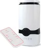 A white humidifier with a black accent band and a remote control. Voir les images du produit