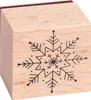 A wooden stamp with a snowflake design. Produktbild-Vorschau