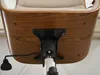 Underside of a chair with visible wooden veneer and metal mechanism. Anteprima dell’immagine prodotto
