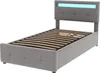 A single bed frame with a grey upholstered headboard and base, featuring integrated blue LED lighting at the top of the headboard. The wooden slatted mattress base is visible. Produktbild-Vorschau