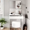 A white vanity table with a mirror, stool, and various makeup items. Podgląd zdjęcia produktu