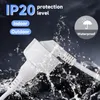 A close-up shot of a white electrical extension cord connector with water splashing around it. Voir les images du produit