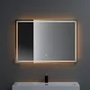 A modern bathroom mirror with integrated LED lighting.