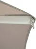 A close-up view of the edge of a beige awning or umbrella, showing the fabric and a metal grommet. Produktbild-Vorschau