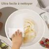 A hand is cleaning a dirty pan with a white cloth, showing how easy it is to clean. Anteprima dell’immagine prodotto
