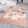 A children's rug with an elephant and heart-shaped balloons is placed on a wooden floor next to a rocking horse and a child's bed.