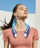 A woman wearing a neck fan outdoors. Produktbild-Vorschau