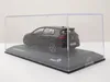 A model car is displayed inside a clear plastic case on a black base. Produktbild-Vorschau