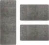 Three gray rugs of different sizes are laid out on a white background. Produktbild-Vorschau