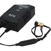A black AEG battery charger with its cables and connectors. Produktbild-Vorschau