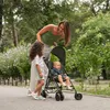 A mother and two children in a park with a stroller. Produktbild-Vorschau