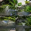 A collage of four close-up shots of a pond fountain in operation, showing different spray patterns. Anteprima dell’immagine prodotto