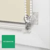 Close-up of a roller blind mechanism with a chain and a chain holder. Produktbild-Vorschau