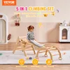 A child playing on a wooden climbing set indoors. Voir les images du produit
