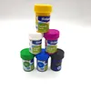 A pyramid stack of small paint pots with colorful lids and labels. Produktbild-Vorschau