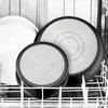 Pots and pans are stacked inside a dishwasher. Anteprima dell’immagine prodotto