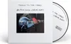 A white softpak CD case with a picture of a person playing a guitar and the CD itself is visible. Produktbild-Vorschau